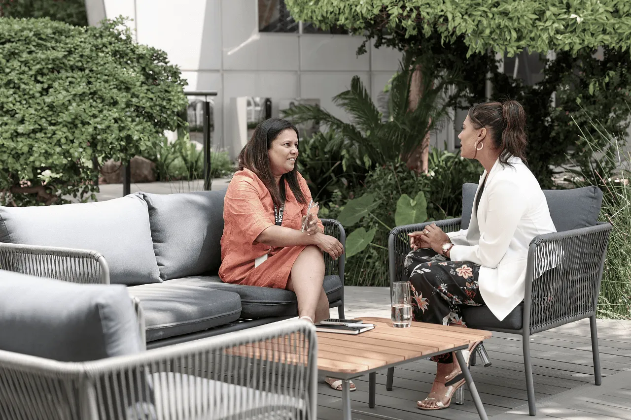 Two Haleon employees are having a conversation