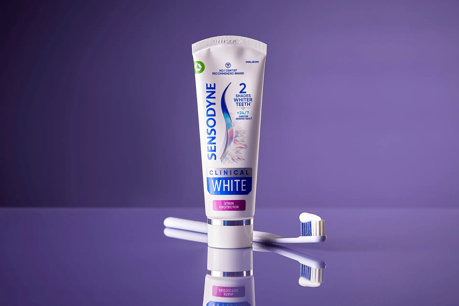 Sensodyne Clinical White toothpaste with purple background. 