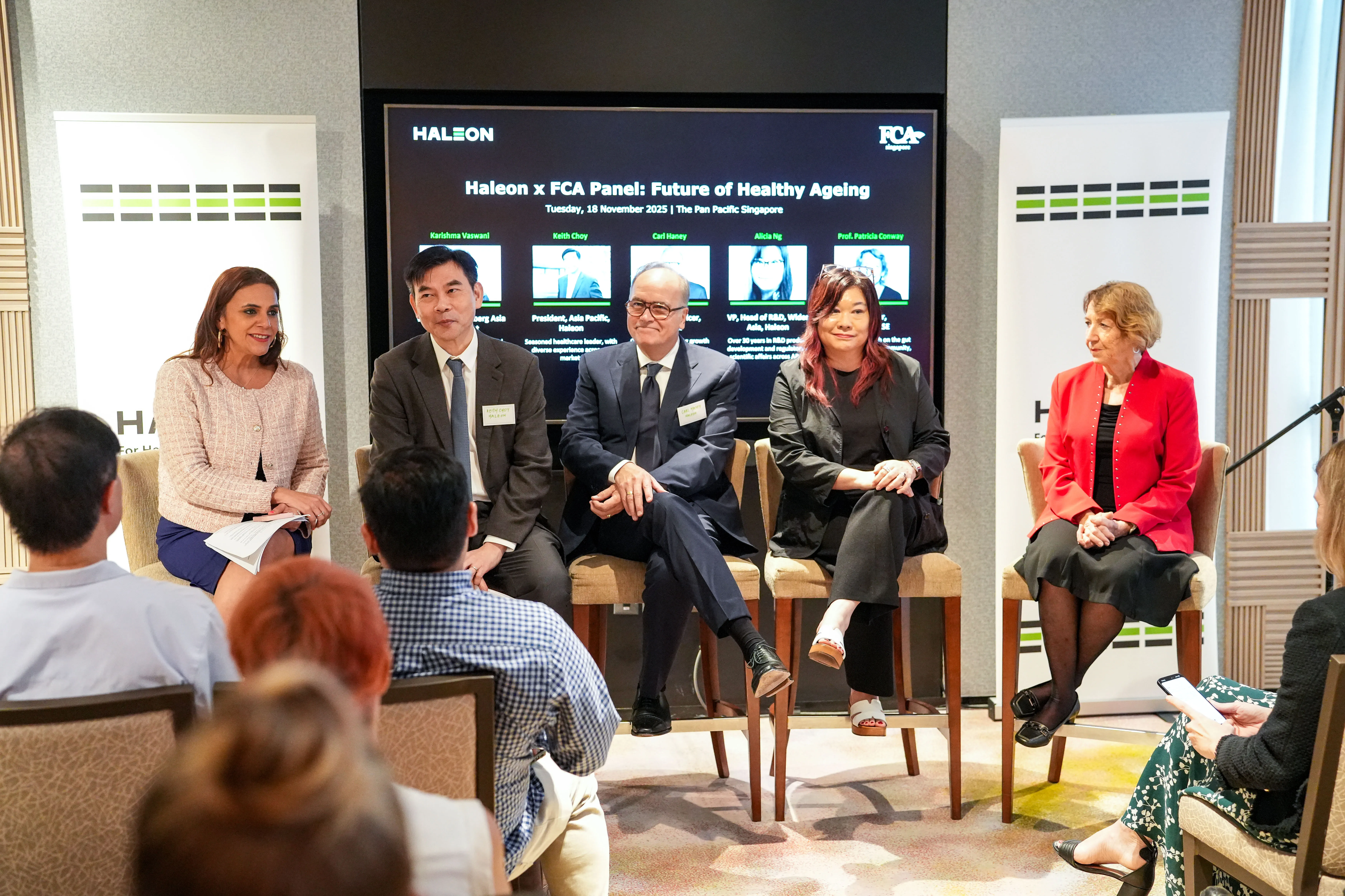Panel of speakers discussing healthy ageing in Asia at a Haleon event, seated in front of an audience during a live Q&A session.