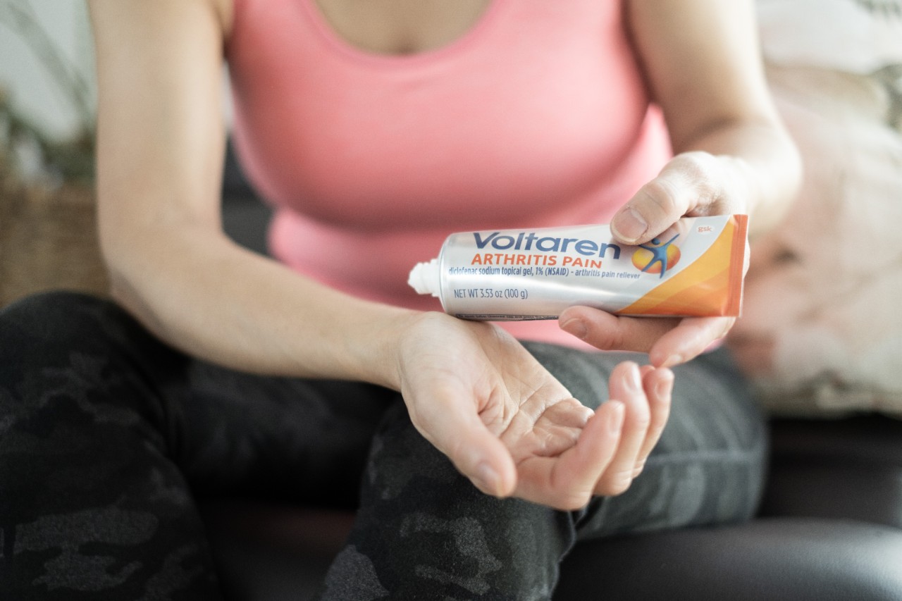 Woman applying Voltaren on her wrist