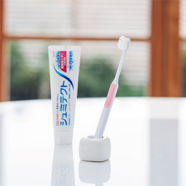 Toothbrush and toothpaste on table