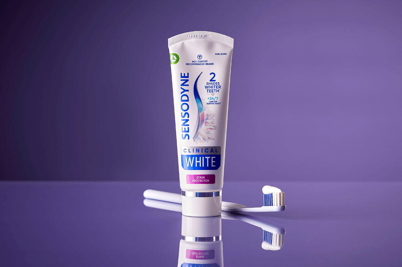 Sensodyne Clinical White toothpaste with purple background. 