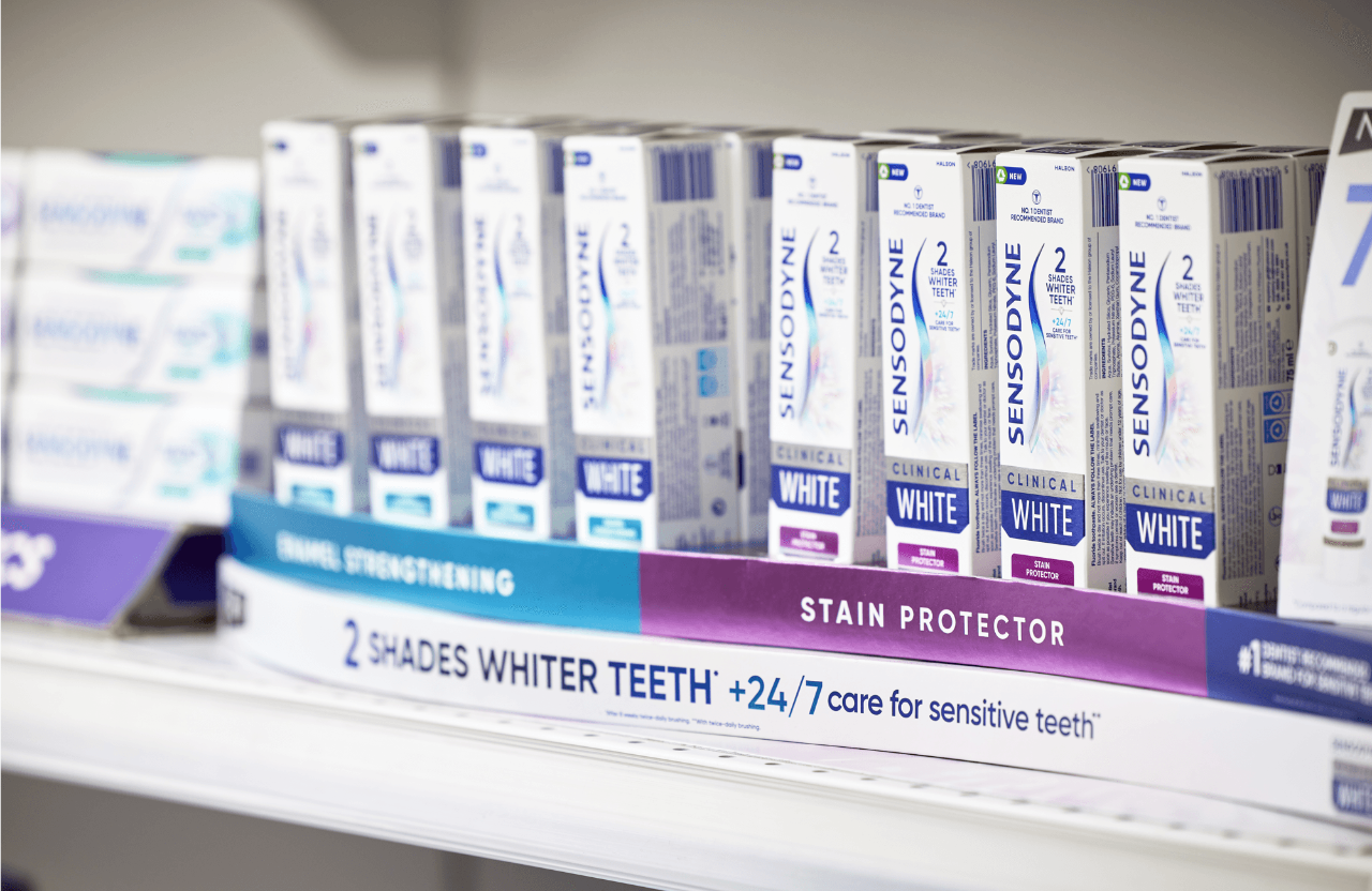Row of Sensodyne Clinical White toothpastes on a shelf