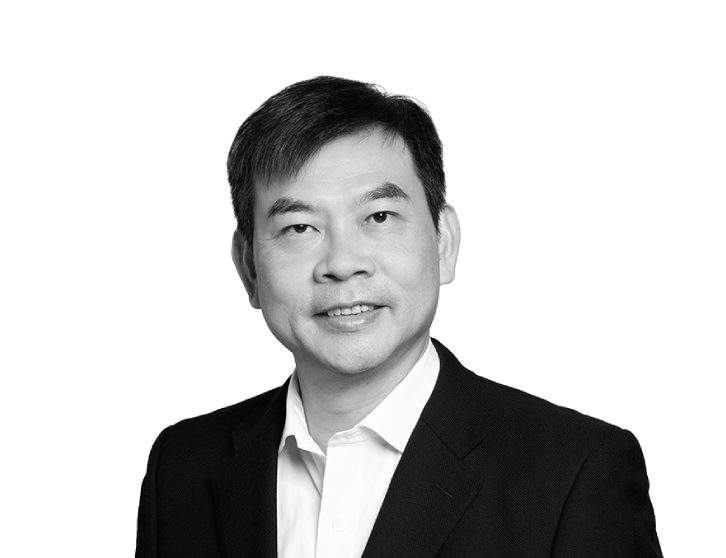 A headshot of Keith Choy, the image is in black and white